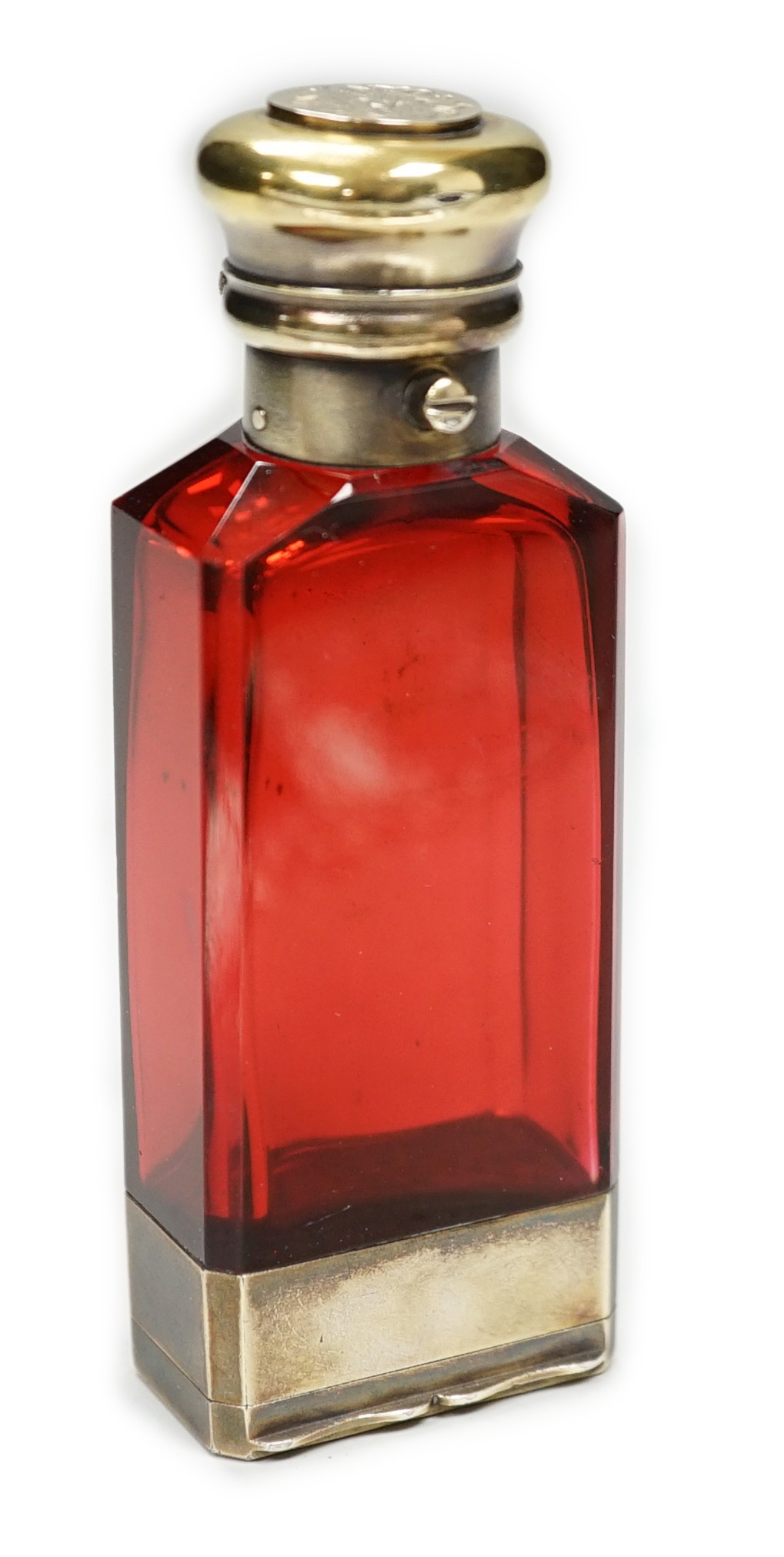 A late Victorian silver gilt mounted ruby glass combination scent bottle/vinaigrette, by Sampson Mordan & Co, London, 1877, 96mm.
